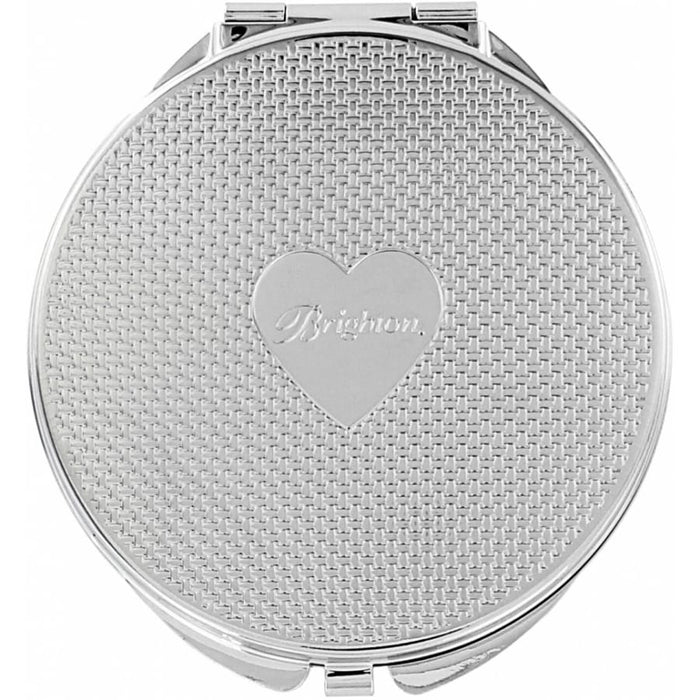 Brighton round compact mirror with silver-tone woven texture and engraved heart emblem on a white background