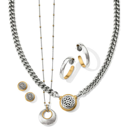 Brighton jewelry set styled with two-tone silver and gold necklaces, hoop earrings, and stud earrings on white background
