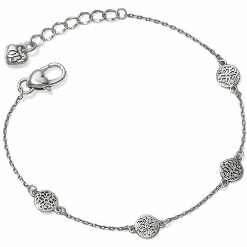 Brighton chain bracelet with three silver-plated openwork medallion stations, heart clasp, and extender chain on a white background