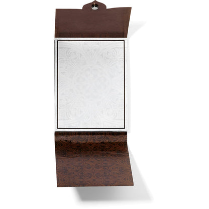 Brighton notepad shown open with brown ornate scroll patterned cover and blank white lined paper on a white background