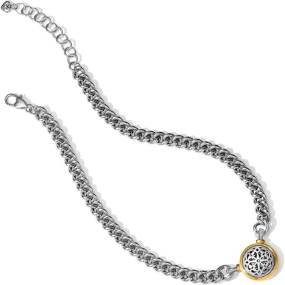 Brighton curb chain necklace with two-tone round filigree pendant and lobster clasp on a white background