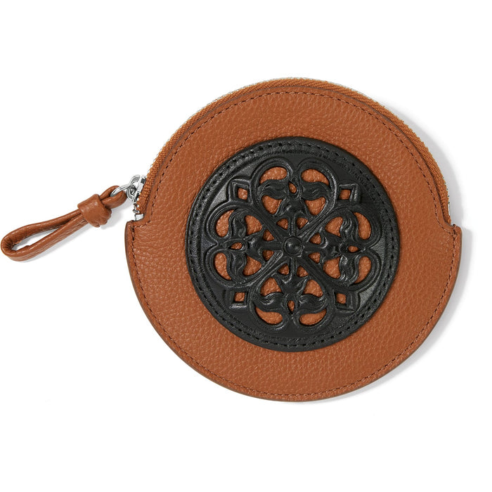 Brighton round leather coin pouch in tan with black ornamental scrollwork medallion and zip closure on a white background