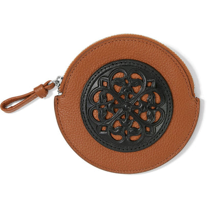 Brighton round leather coin pouch in tan with black ornamental scrollwork medallion and zip closure on a white background
