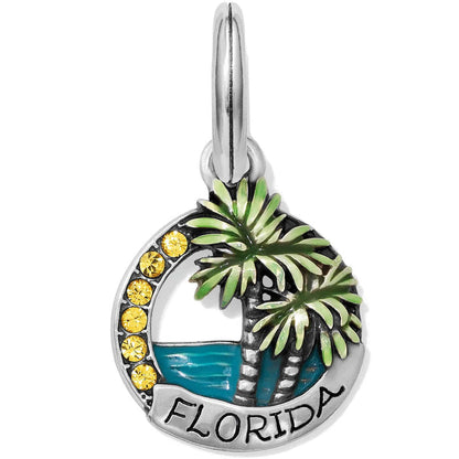 Brighton Florida charm with green palm trees, blue water, yellow crystals, and silver-plated finish on a white background