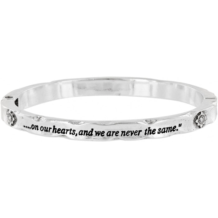 Brighton bangle bracelet with silver-tone hammered finish, engraved inscription, and small floral crystal accents on a white background