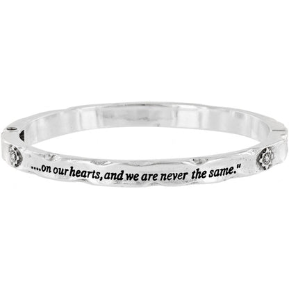 Brighton bangle bracelet with silver-tone hammered finish, engraved inscription, and small floral crystal accents on a white background