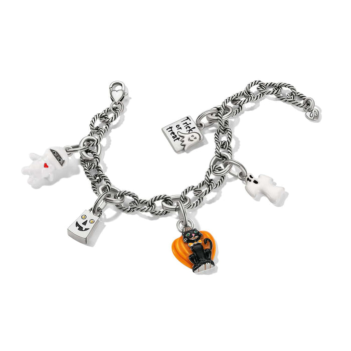 Brighton silver-plated charm bracelet with enamel ghost, pumpkin, black cat, and trick-or-treat charms on a white background