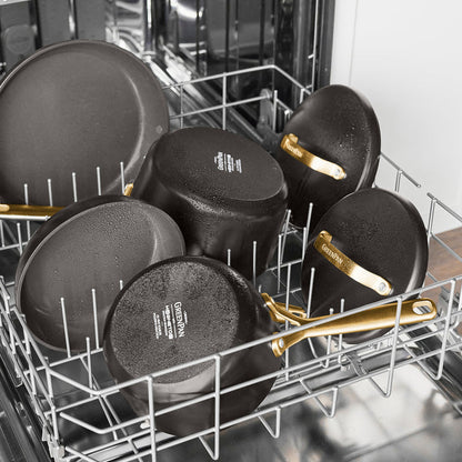 Two cocoa ceramic nonstick frypans with champagne handles placed upside down in a dishwasher.