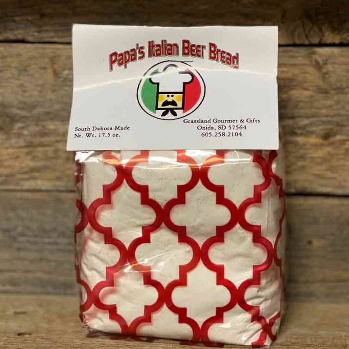 Bag of Papa's Italian Beer Bread with a red and white pattern on a wooden background