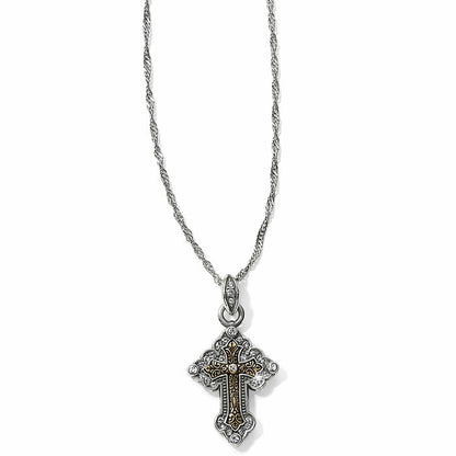 Brighton pendant necklace with two-tone cross featuring crystal accents and gold scrollwork on a white background
