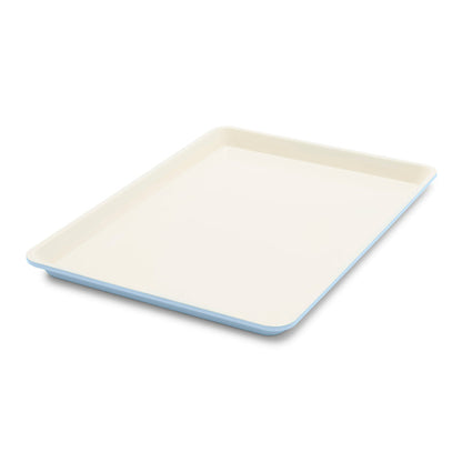 Blue haze ceramic nonstick cookie sheet, 18 by 13 inches, with smooth surface and raised edges.