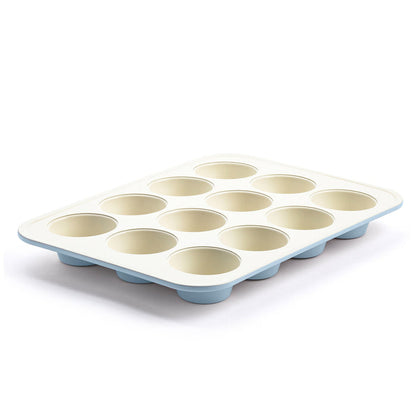 Blue ceramic 12-cup muffin pan with nonstick coating, featuring GreenLife branding on the rim.