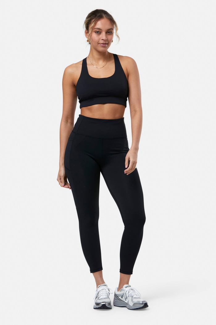 Model wearing Gym+Coffee Relentless Bra Black by Gym+Coffee, available to shop at Dotique.