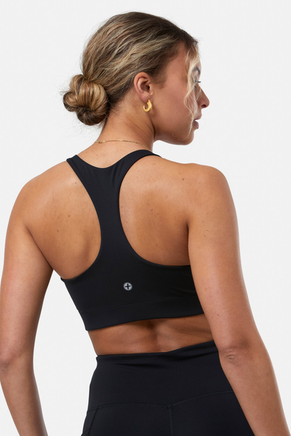 Athletic woman wearing Gym+Coffee Relentless Bra Black from Gym+Coffee, shop Gym+Coffee at Dotique.