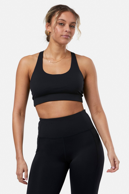 Woman wearing Gym+Coffee Relentless Bra Black by Gym+Coffee showcasing the fit, shop Gym+Coffee at Dotique.