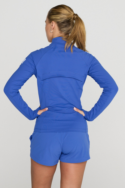 Model wearing Gym+Coffee Relentless Full Zip Tidal Blue jacket from Gym+Coffee, shop Gym+Coffee at Dotique.