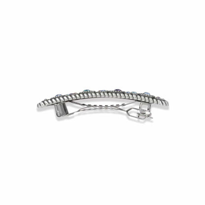 Brighton hair barrette shown from the back with silver-plated clasp mechanism and crystal-topped edge on a white background