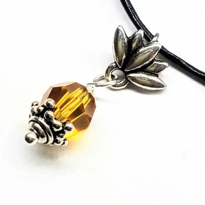 Handmade silver crystal pineapple leather necklace featuring a bright yellow Austrian Swarovski crystal and silver pineapple charm.