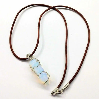 Handmade Silver Wire Wrapped Gemstone Crystal Point Pendant on a leather cord, showcasing its unique beauty and craftsmanship.