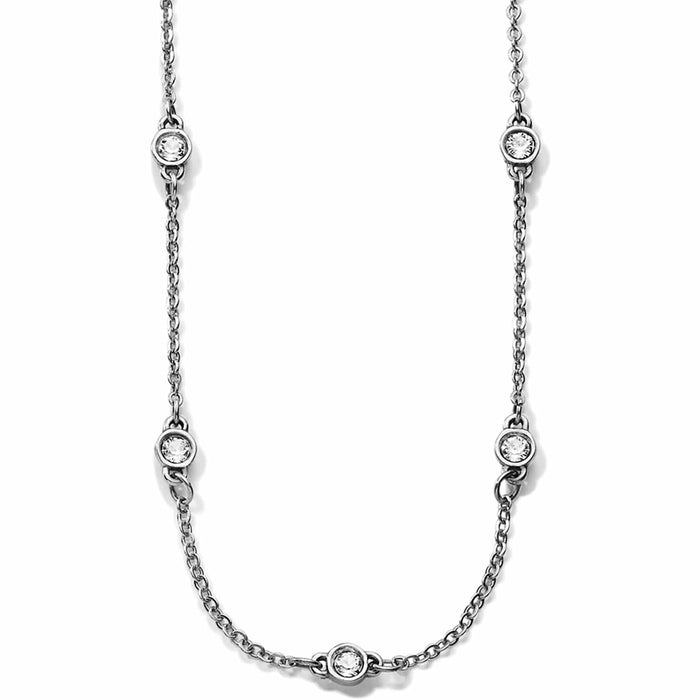 Brighton silver-tone chain necklace with five round crystal stations in bezel settings on a white background