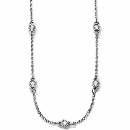 Brighton silver-tone chain necklace with five round crystal stations in bezel settings on a white background