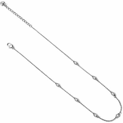 Brighton silver-tone station necklace with small crystal accents along delicate chain and lobster clasp on a white background