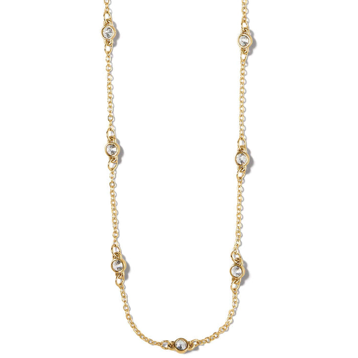 Brighton station necklace with gold-plated chain and round crystal accents spaced along the length on a white background
