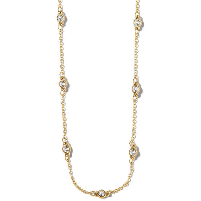 Brighton station necklace with gold-plated chain and round crystal accents spaced along the length on a white background