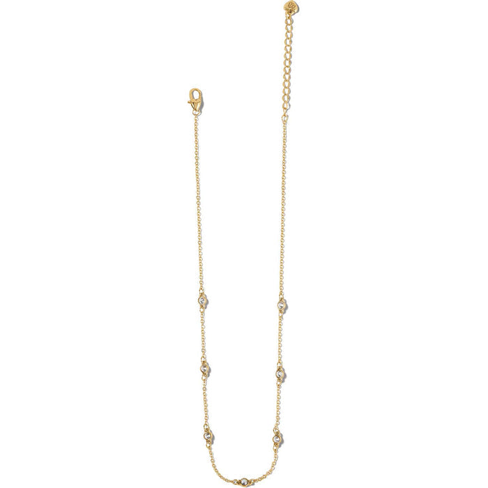 Brighton gold-plated chain necklace with crystal stations, lobster clasp, and adjustable extender on a white background