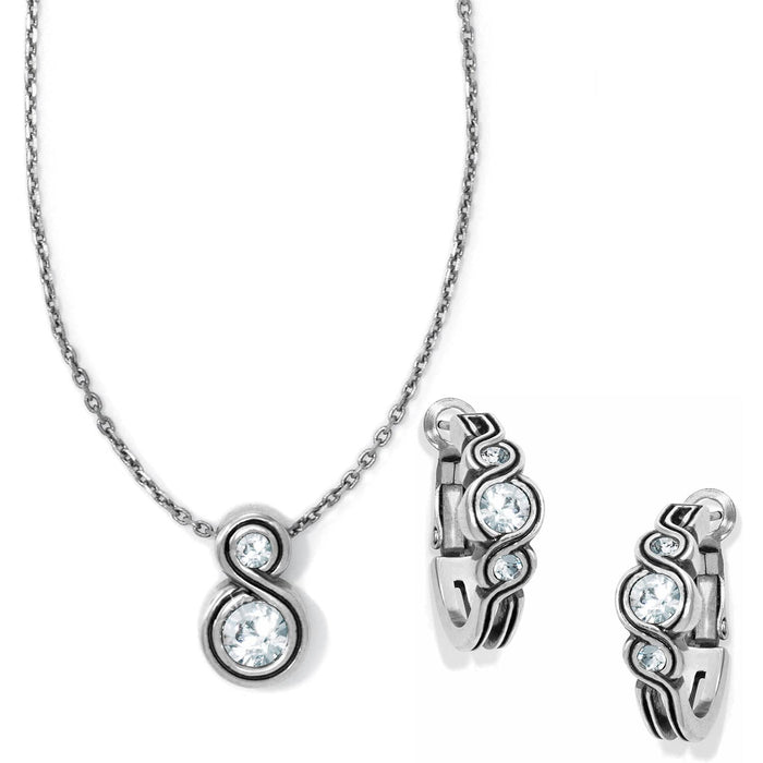 Brighton necklace and hoop earrings set with silver-tone swirl design and crystal accents on a white background