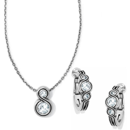 Brighton necklace and hoop earrings set with silver-tone swirl design and crystal accents on a white background