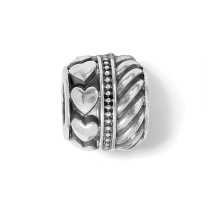 Brighton silver-plated bead charm with raised heart motifs, beaded trim, and twisted rope pattern on a white background