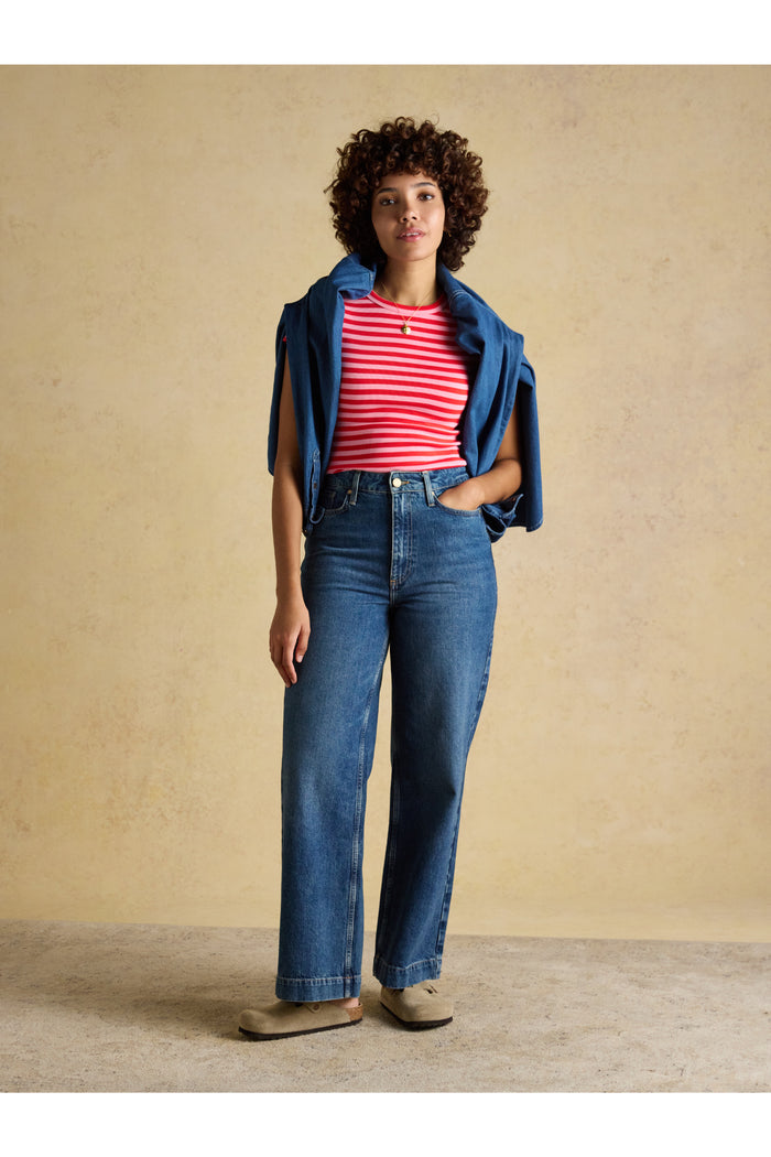 Woman wearing Joules H18088 Sophie Ribbed T-Shirt – Pink / Red Stripe styled with jeans, shop Joules at Dotique.