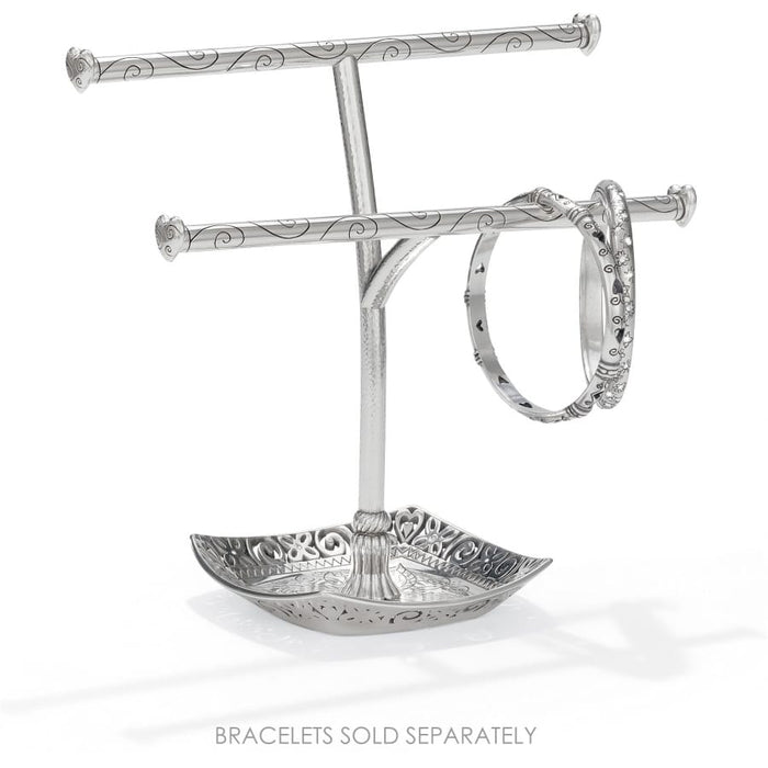 Brighton silver-plated two-tier bracelet stand with scroll-engraved bars, decorative tray base, and one bangle on a white background