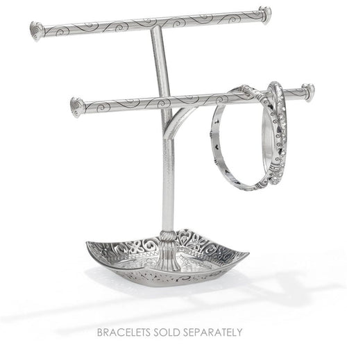 Brighton silver-plated two-tier bracelet stand with scroll-engraved bars, decorative tray base, and one bangle on a white background