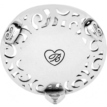 Brighton round silver-tone trinket dish with cutout scroll border and engraved heart B monogram on a white background