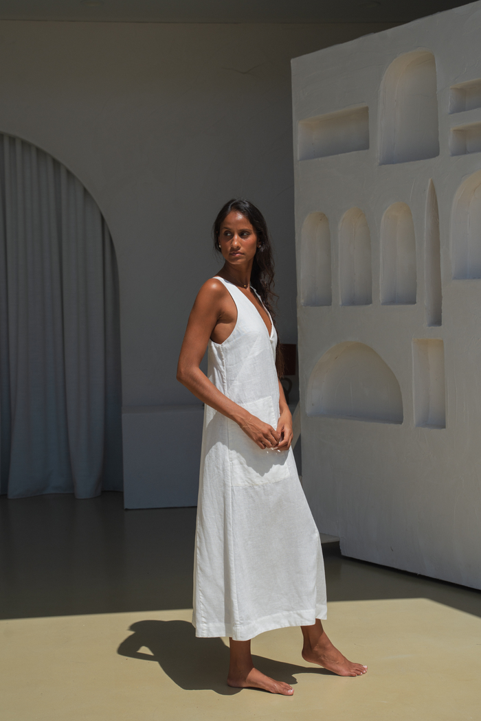 Model wearing Lilly Pilly LP-D018 Iris Linen Dress Ivory by Lilly Pilly in minimalist setting, shop Lilly Pilly at Dotique.