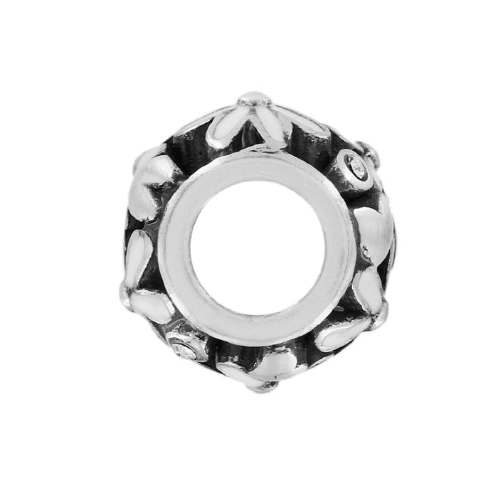 Brighton silver-tone charm bead with white enamel floral pattern and crystal accents on a white background