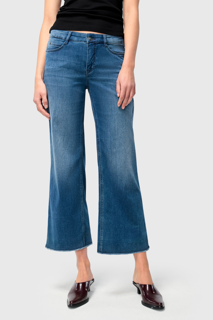 Designed for effortless style and comfort, the Dotique MAC Dream Wide Cropped Jeans in Storm Blue Wash offer a modern, relaxed silhouette. Shop MAC Jeans at Dotique.