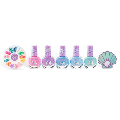 The Martinelia Let's Be Mermaids Nails Design Kit by Martinelia features five pastel polishes, a round box of nail decorations, and a seashell-shaped buffer—a whimsical set for playful kids displayed on a white background.