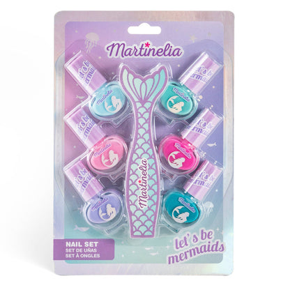 The Martinelia Let's Be Mermaids Nails Set by Martinelia features five pastel kids nail polishes and three mini jars in mermaid-themed packaging with a large mermaid tail and “let’s be mermaids” on an ocean-inspired background.