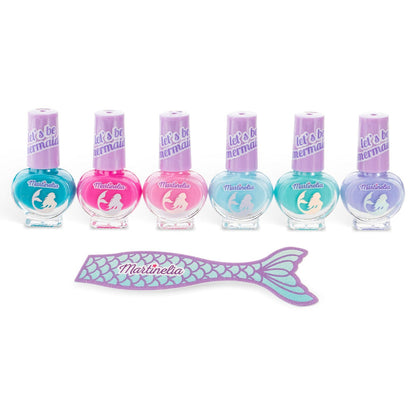 The Martinelia Let's Be Mermaids Nails Set features six colorful bottles in pink, purple, blue, and teal with purple caps, plus a mermaid tail-shaped nail file—perfect for creative kids’ manicures. Brand: Martinelia.