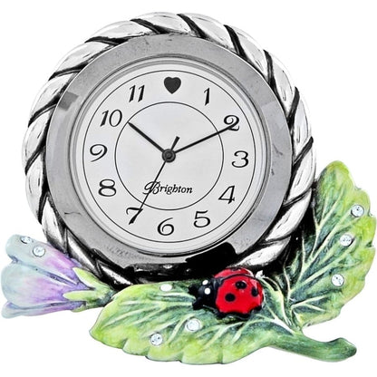Brighton clock with silver-tone braided frame, enamel green leaf, purple bud, and red ladybug on a white background