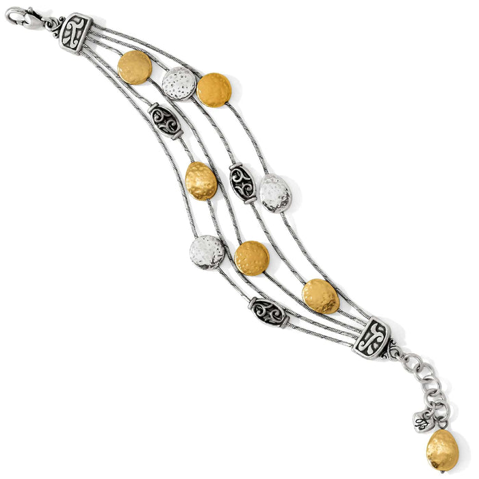 Brighton multi-strand bracelet with hammered silver-plated and gold-plated discs and scrollwork stations on a white background