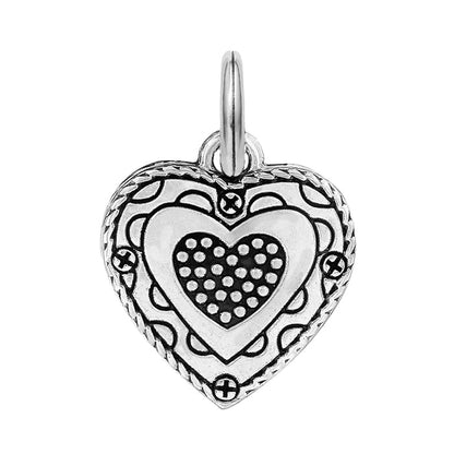 Brighton heart charm with silver-plated finish, dotted center, scrollwork border, and split ring on a white background