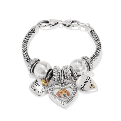 Brighton charm bracelet with silver-plated heart charms, crystal beads, and dog photo locket on a white background