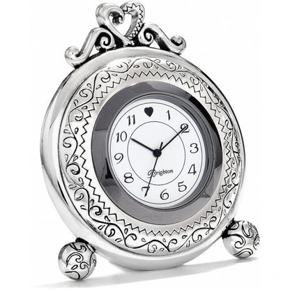 Brighton silver-plated tabletop clock with ornate scrollwork frame, heart-topped crown, and round white dial on a white background