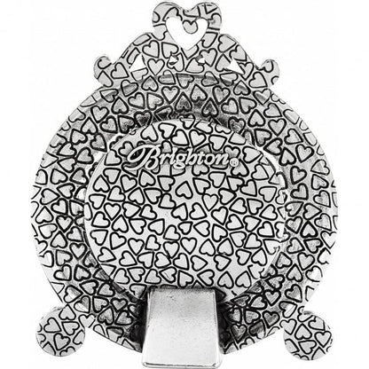 Brighton silver-plated money clip with allover embossed heart pattern and decorative crown top on a white background