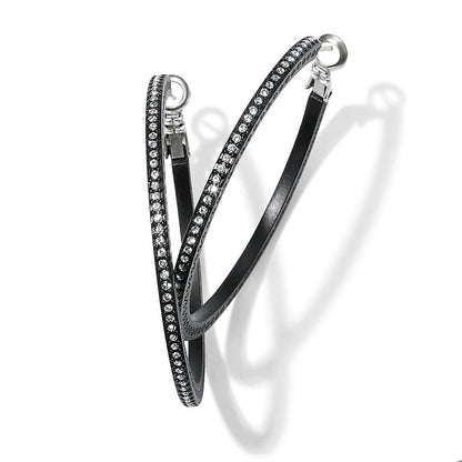 Brighton hoop earrings with black lacquer finish and pavé crystal accents along the front on a white background