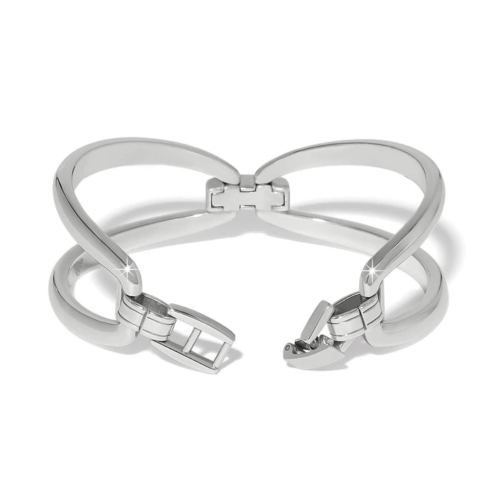 Brighton silver-plated hinged cuff bracelet shown open with polished crossover bands and clasp on a white background